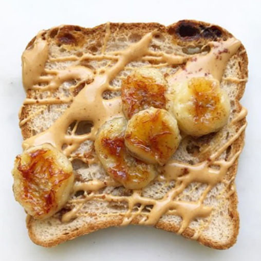 caramelized bananas with drizzled peanut butter on toast