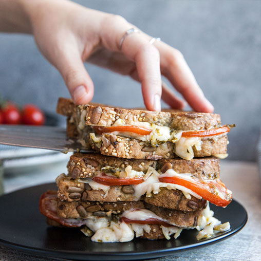 Caprese grilled cheese sandwich with onions and peppers
